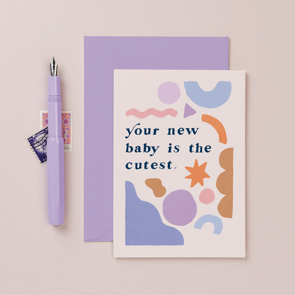A gender neutral baby card with illustrated shapes and hand lettering on a new baby card from the unisex baby collection at Sister Paper Co.