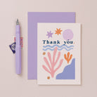 A stylish thank you card with illustrated shapes and hand lettering on a thanks card from the thank you collection at Sister Paper Co.