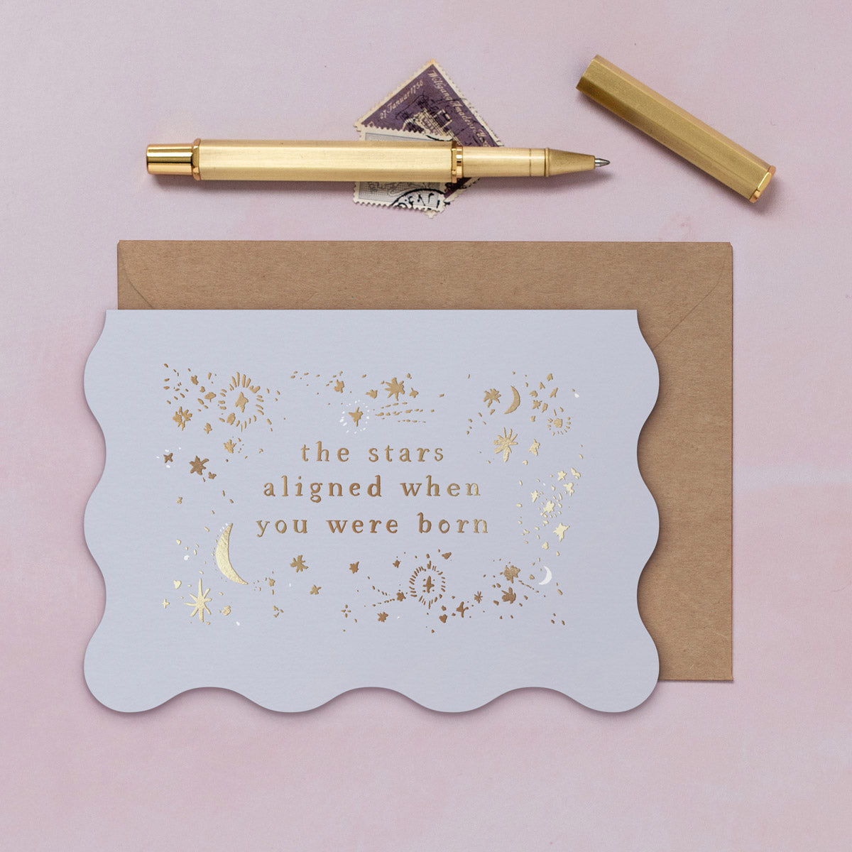 A birthday card featuring luxe stamped gold foil details from the Cosmique range of greeting cards from Sister Paper Co.