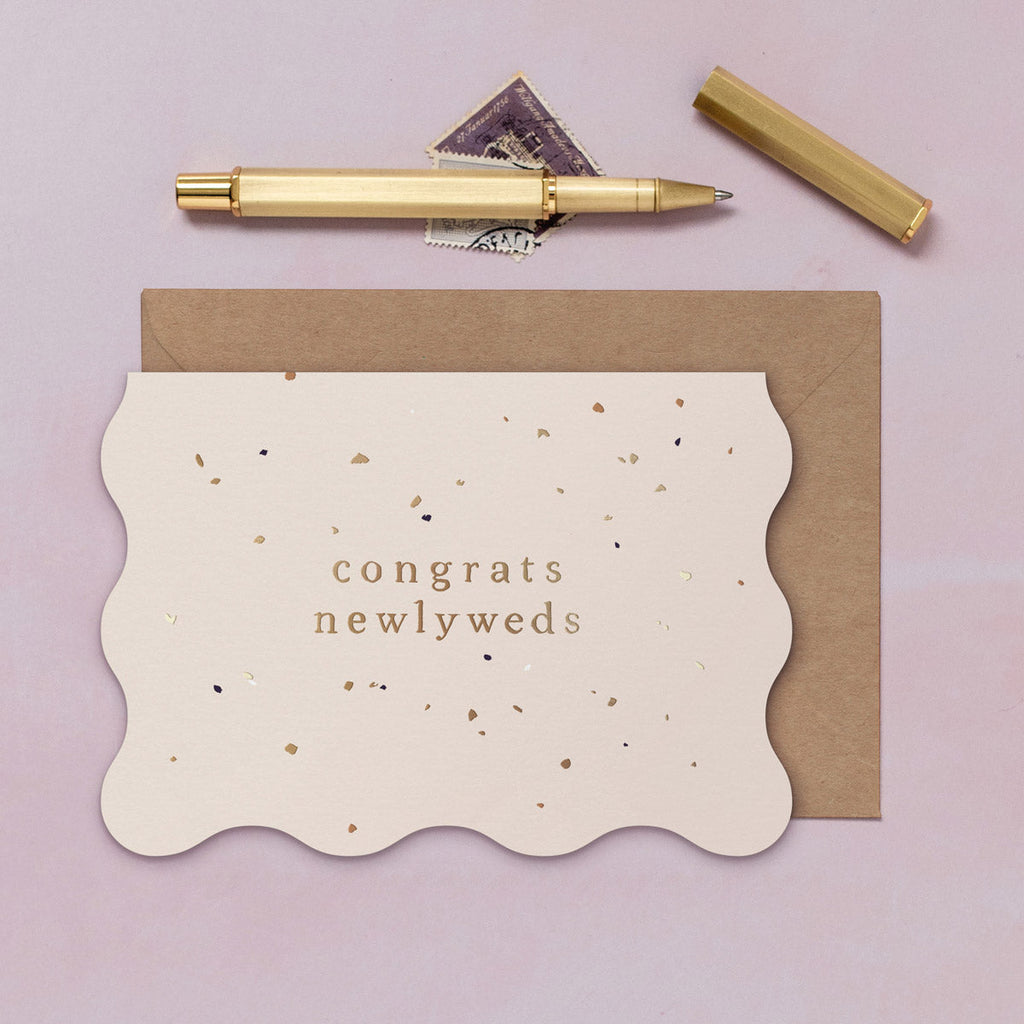 A wedding card featuring luxe stamped gold foil details from the Cosmique range of greeting cards from Sister Paper Co.