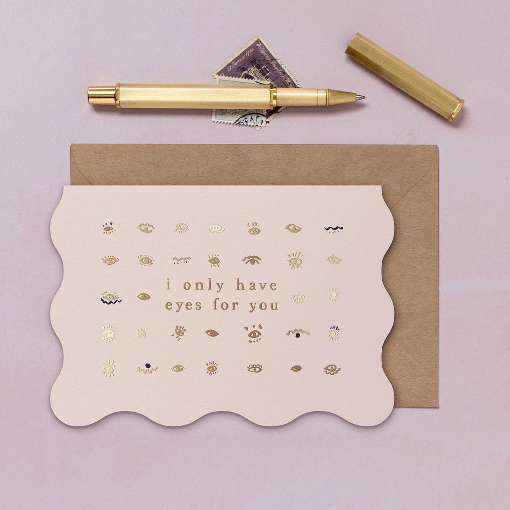A love card featuring luxe stamped gold foil details from the Cosmique range of greeting cards from Sister Paper Co.