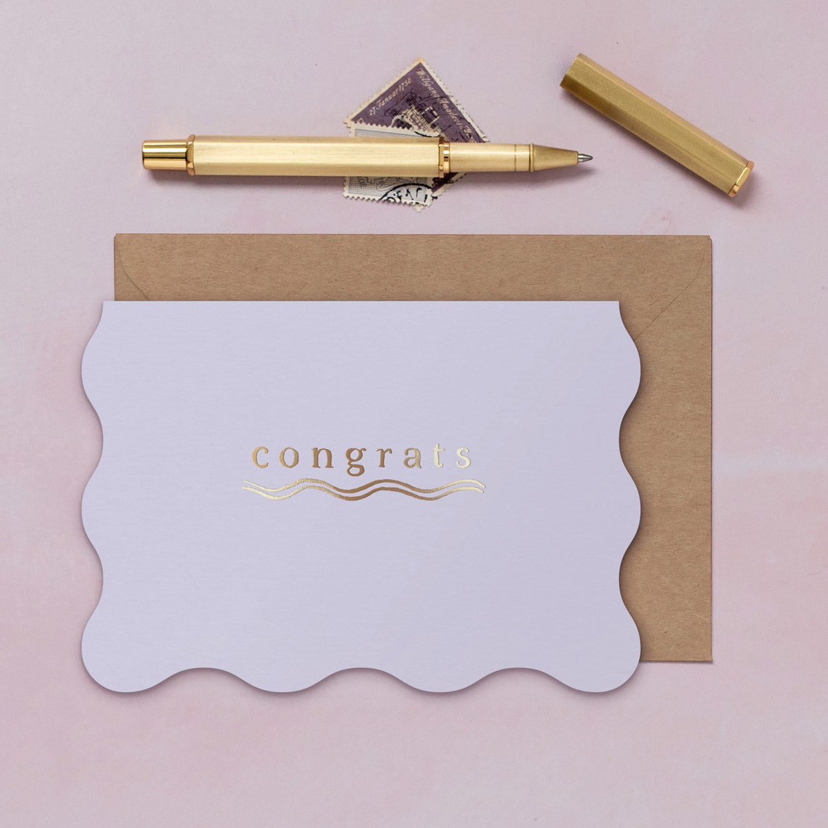 A congratulations card featuring luxe stamped gold foil details from the Cosmique range of greeting cards from Sister Paper Co.