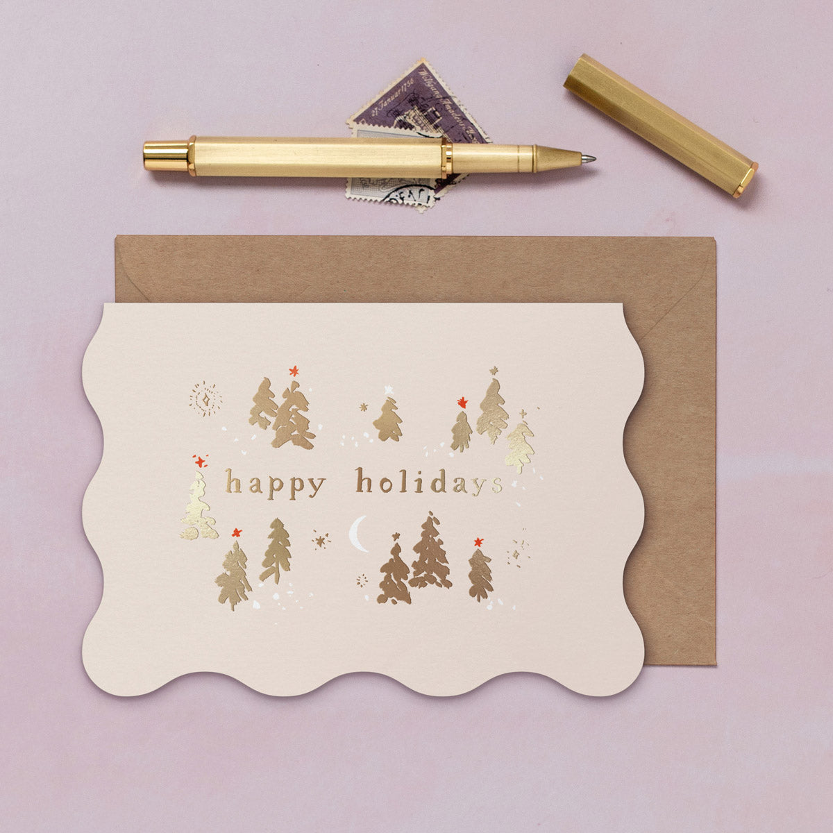 A wavy edge Christmas card with sparkly gold foil tree details from the Sister Paper Co. collection of Christmas cards.