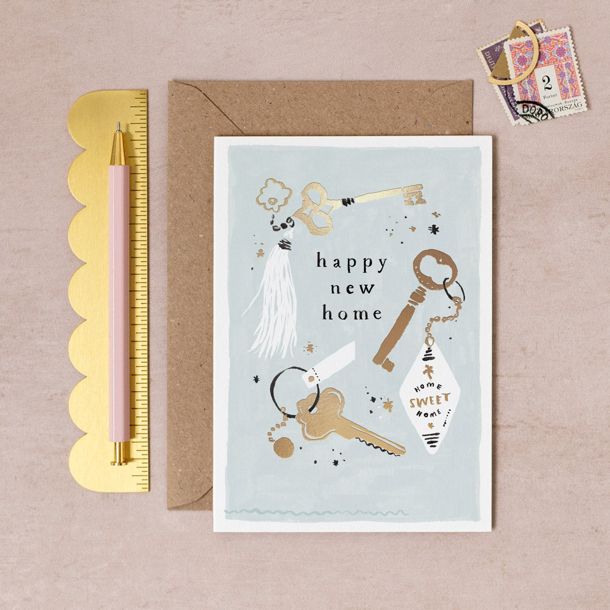 A keys new home card with gold foil details from Sister Paper Co.