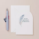 A sympathy card featuring a feather from Sister Paper Co.