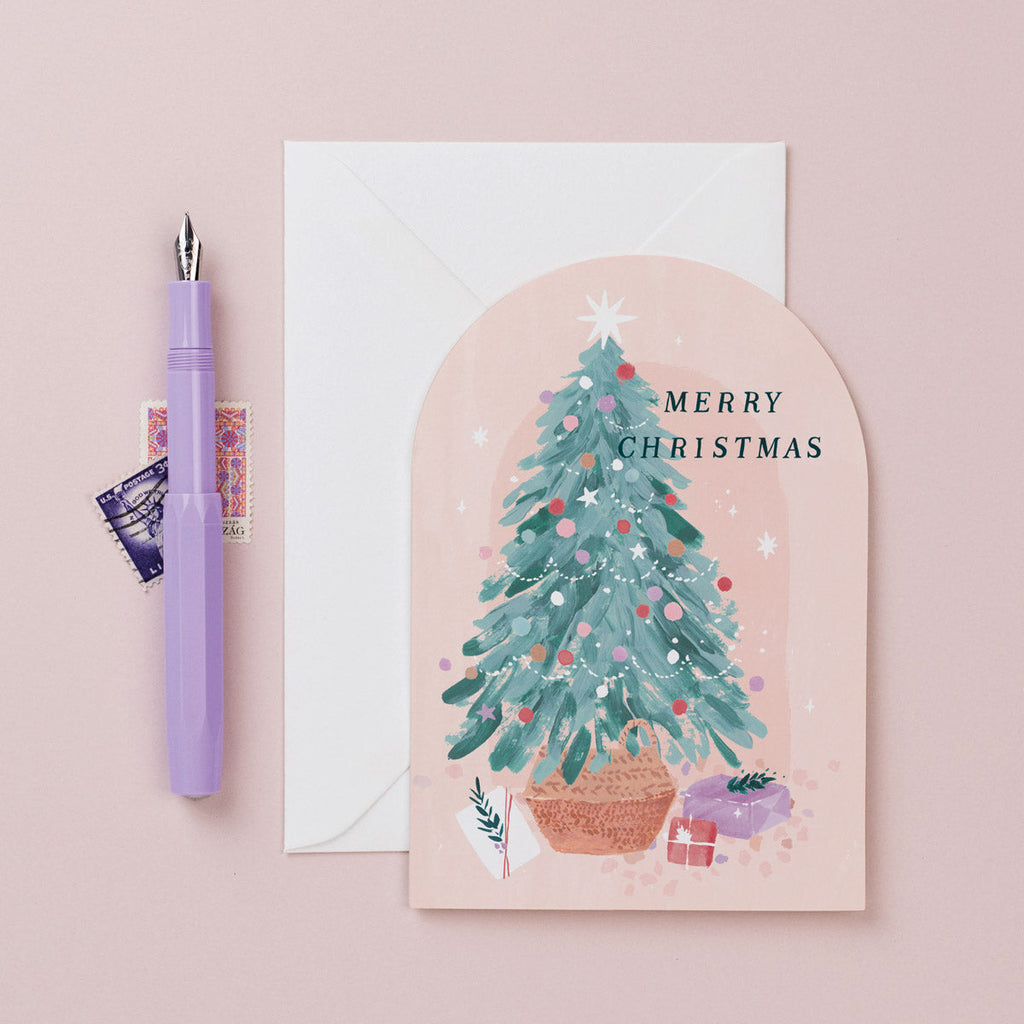 A Christmas card featuring a Christmas tree and presents from the Nevada holiday card collection at Sister Paper Co.