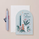 A Christmas card featuring candles and foliage from the Nevada holiday card collection at Sister Paper Co.