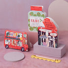 Children's birthday card cut into a bus shape filled with adorable animals riding  along in the party bus.