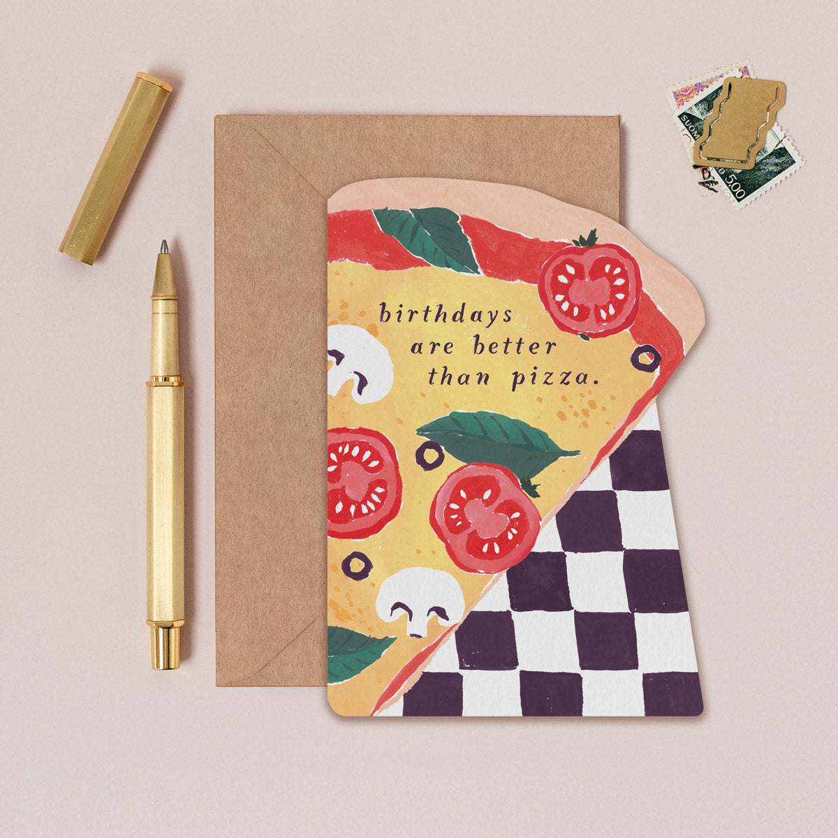 A birthday card in the shape of a pizza slice from Sister Paper Co.