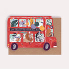 A kids birthday card cut into the shape of bus full of animals from the wholesale Childrens card collection at Sister Paper Co.