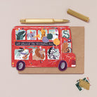 A kids birthday card cut into the shape of bus full of animals from the wholesale Childrens card collection at Sister Paper Co.