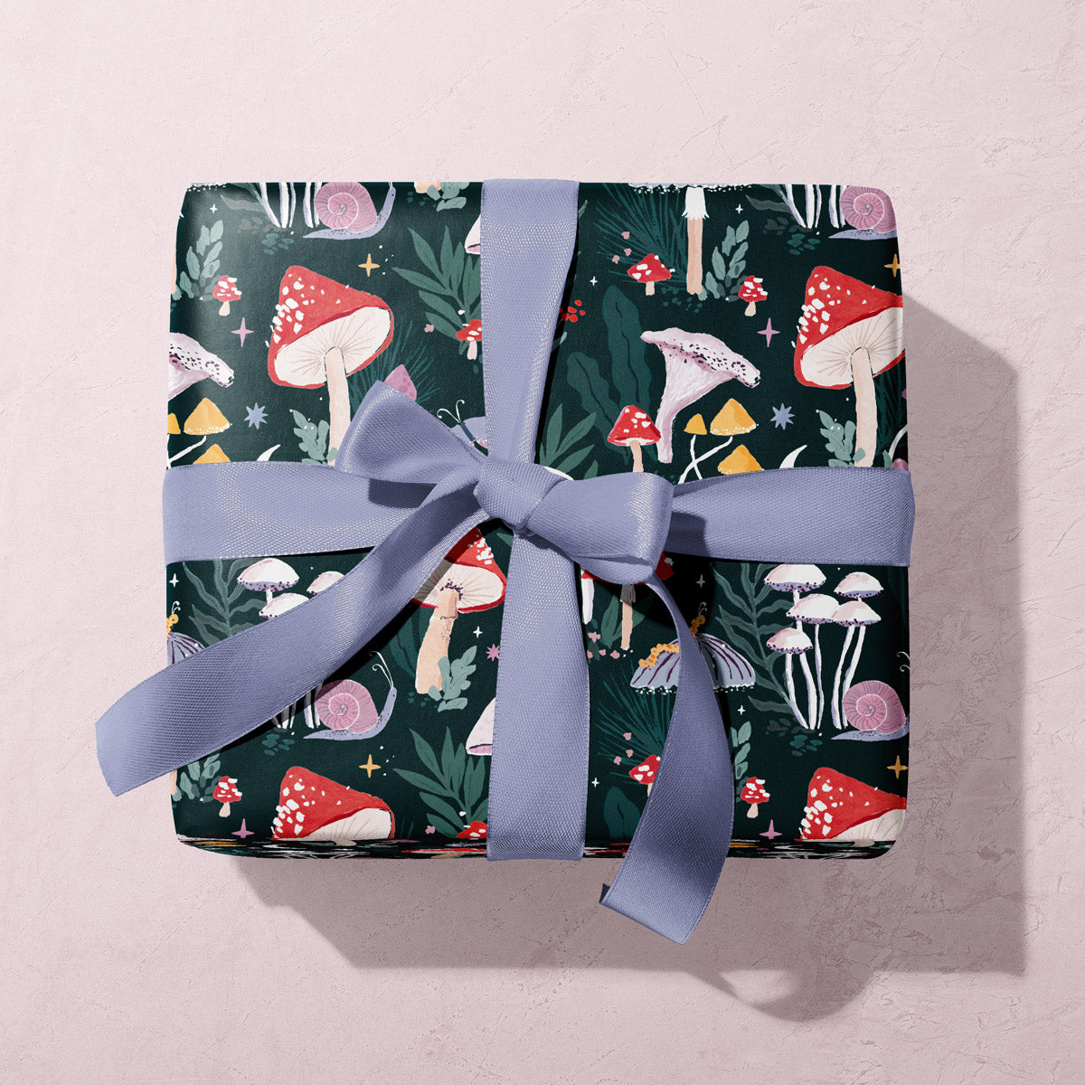 A mystical mushrooms print on this mushroom gift wrap from the wholesale wrapping paper sheets collection at Sister Paper Co.