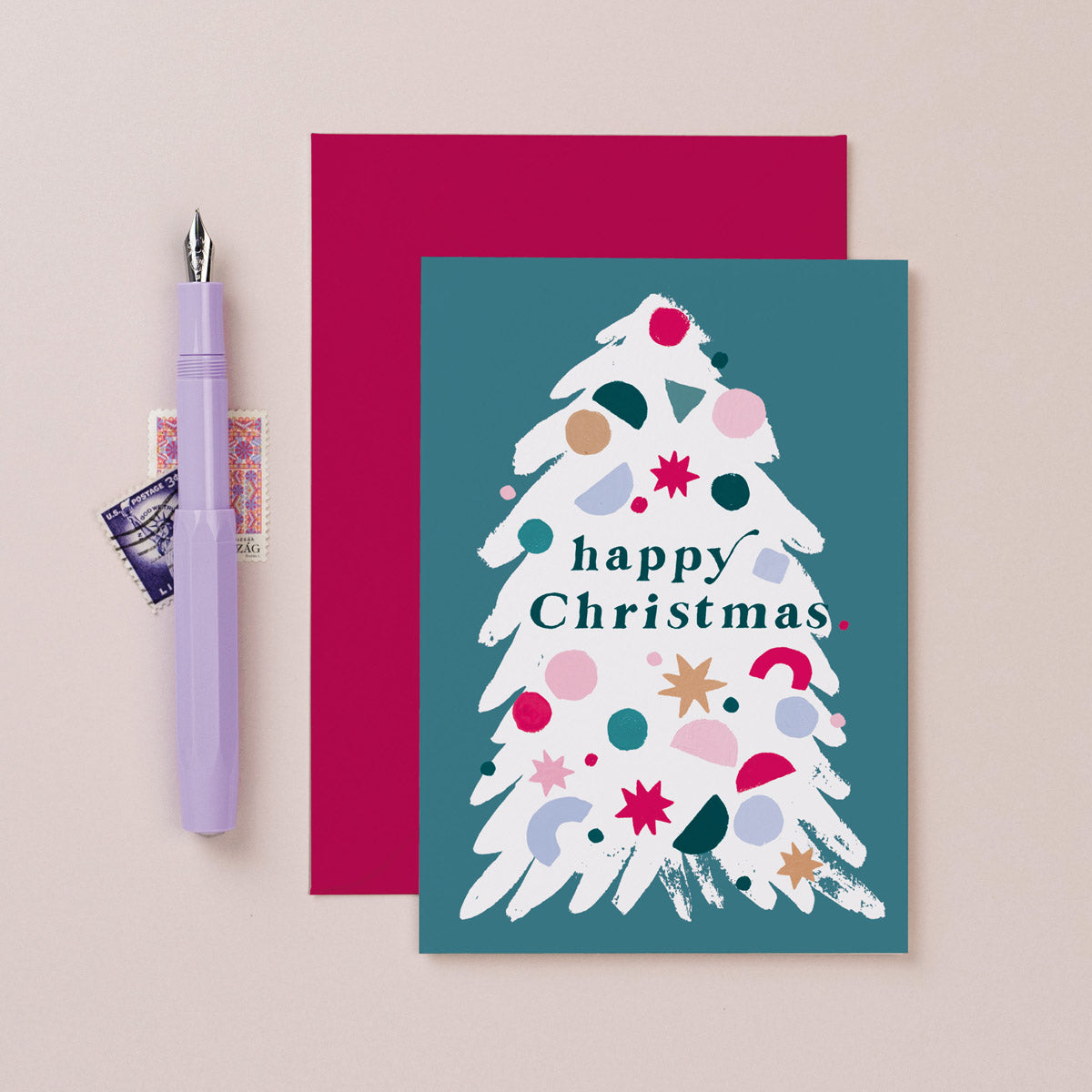 A fun illustration of a Christmas tree on a Christmas card from the colourful Christmas card collection at Sister Paper Co.