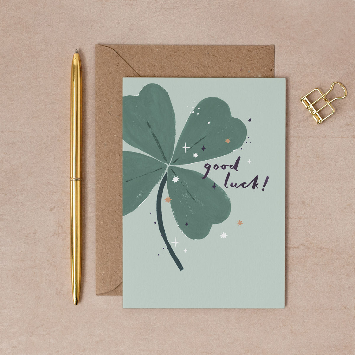 A four leaf clover on a modern good luck card from the card collection at Sister Paper Co.