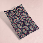 A mystical, floral snake print on wrapping paper from the female birthday wrapping paper collection at Sister Paper Co.