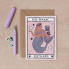 A handmade tarot card style star with illustrated beautiful mermaid and magic birthday hand lettering on a birthday card from the female birthday card collection at Sister Paper Co.