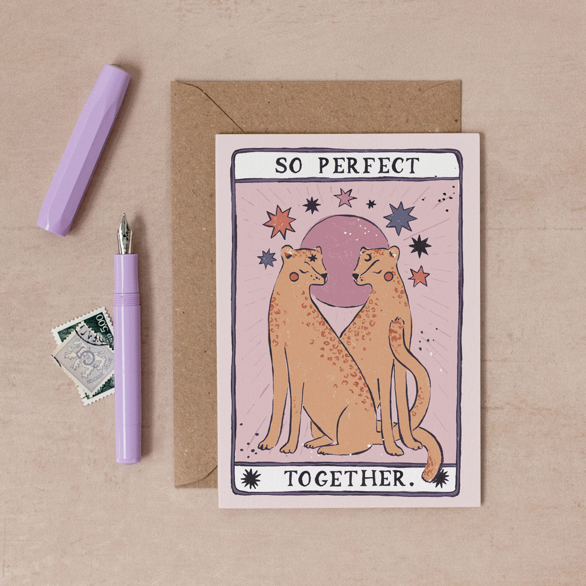 A handmade tarot style card with illustrated leopards and perfect together hand lettering on an anniversary card from the wedding card collection at Sister Paper Co.