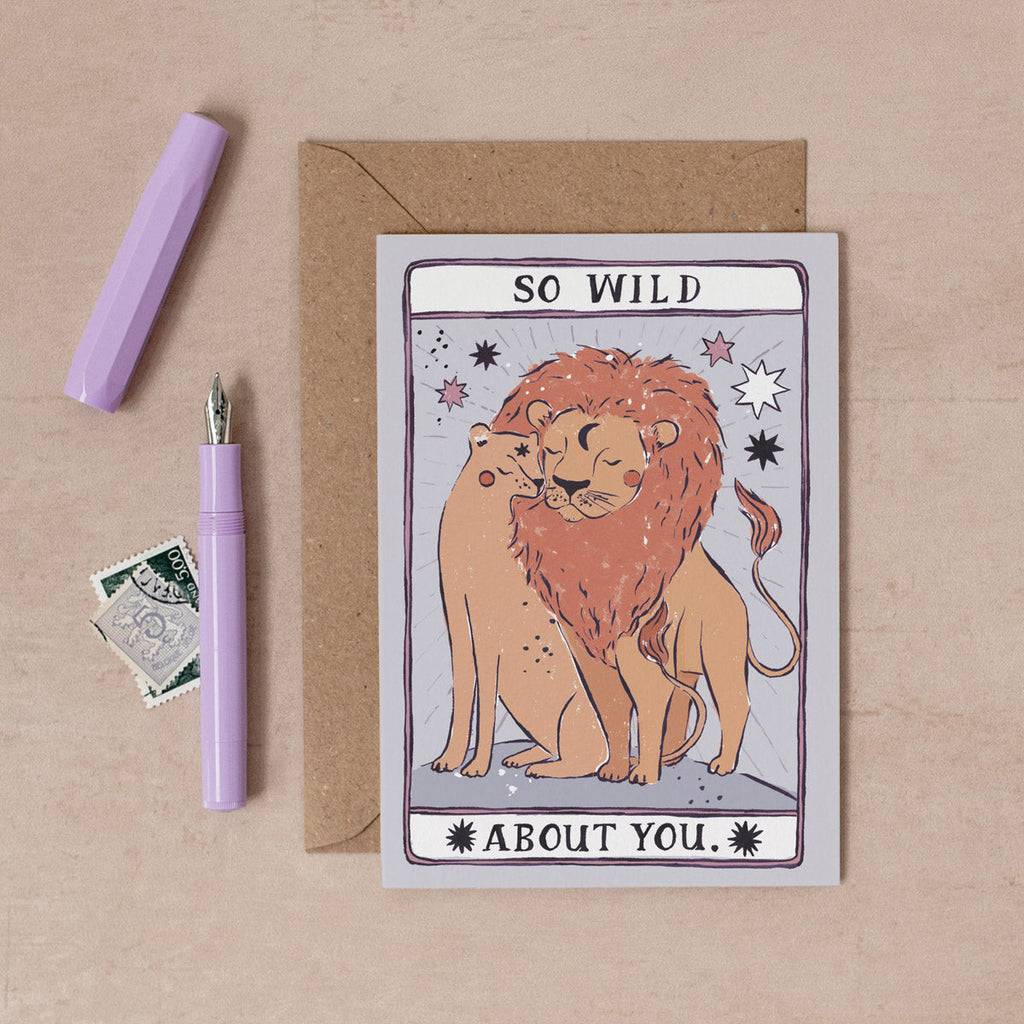A male and female lion show their love with pride on this illustrated love and anniversary card inspired by the Tarot. From the love and occasion collection at Sister Paper Co.