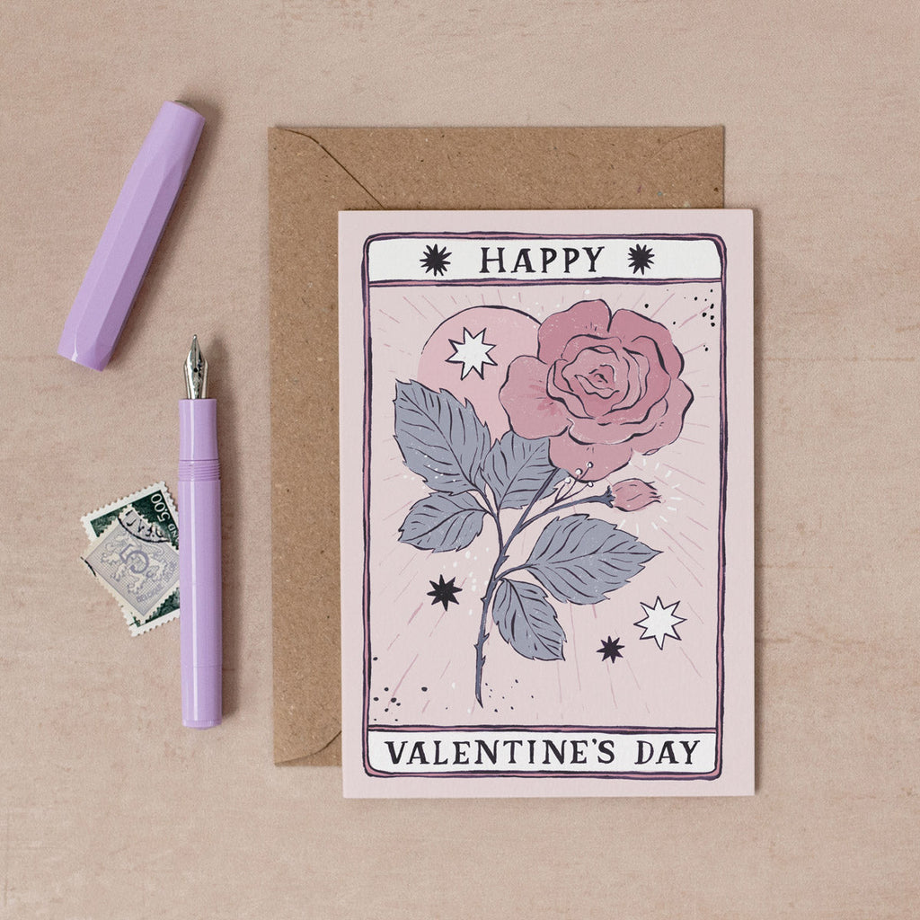 A hand-painted rose with the words 'Happy Valentine's Day' on this Tarot inspired love card. From the Valentine's Day collection at Sister Paper Co.