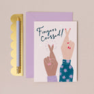 A pair of fingers crossed on a good luck card from the card collection at Sister Paper Co.